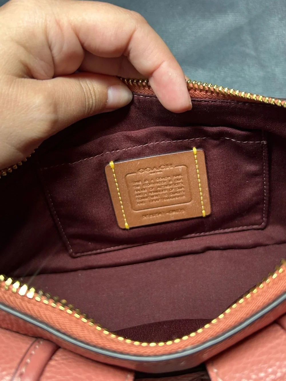 Coach Coral Pink Pebbled Leather Shoulder Bag with Front Buckle Pockets